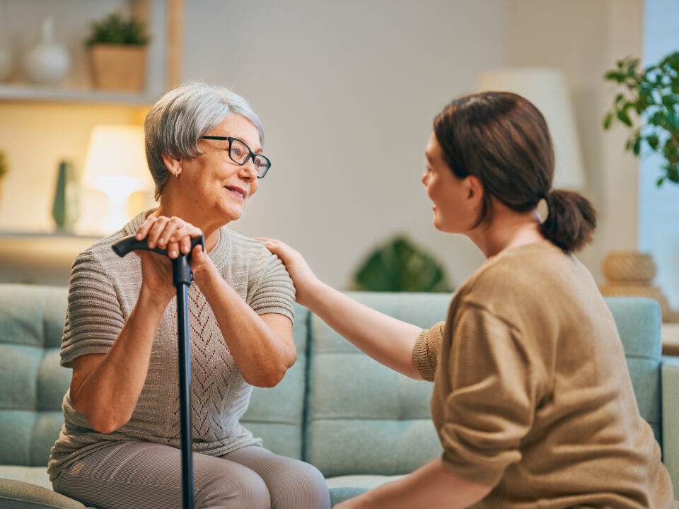 Caregiver assisting senior in home